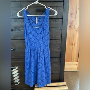 New with tags blue dress with a cute cutout in the back.